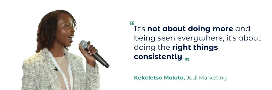 A Woman In A White Blazer Speaks Into A Microphone – Keleketso Moloko, Jodi Marketing