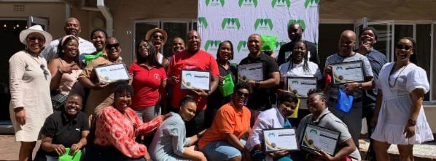Team Of Cleaning Staff Posing Outdoors.