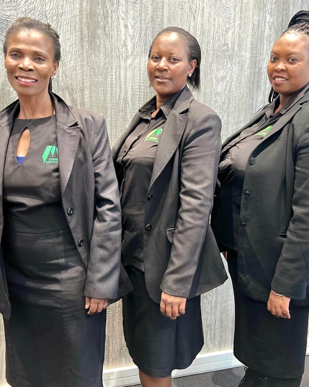 Three Female Staff Members In Formal Uniforms.